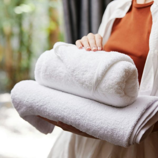 Woman towel closeup laundry stacked person service holding clean female hotel